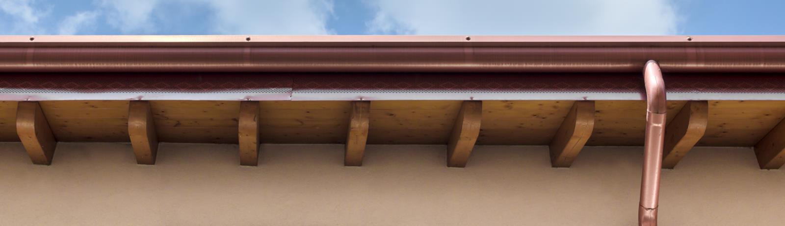 newly installed copper gutters with wooden fascia